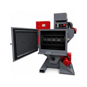 Angle view of a Winona Van Norman Fixed Basket Blaster designed for precision shot blasting of engine components and industrial parts.