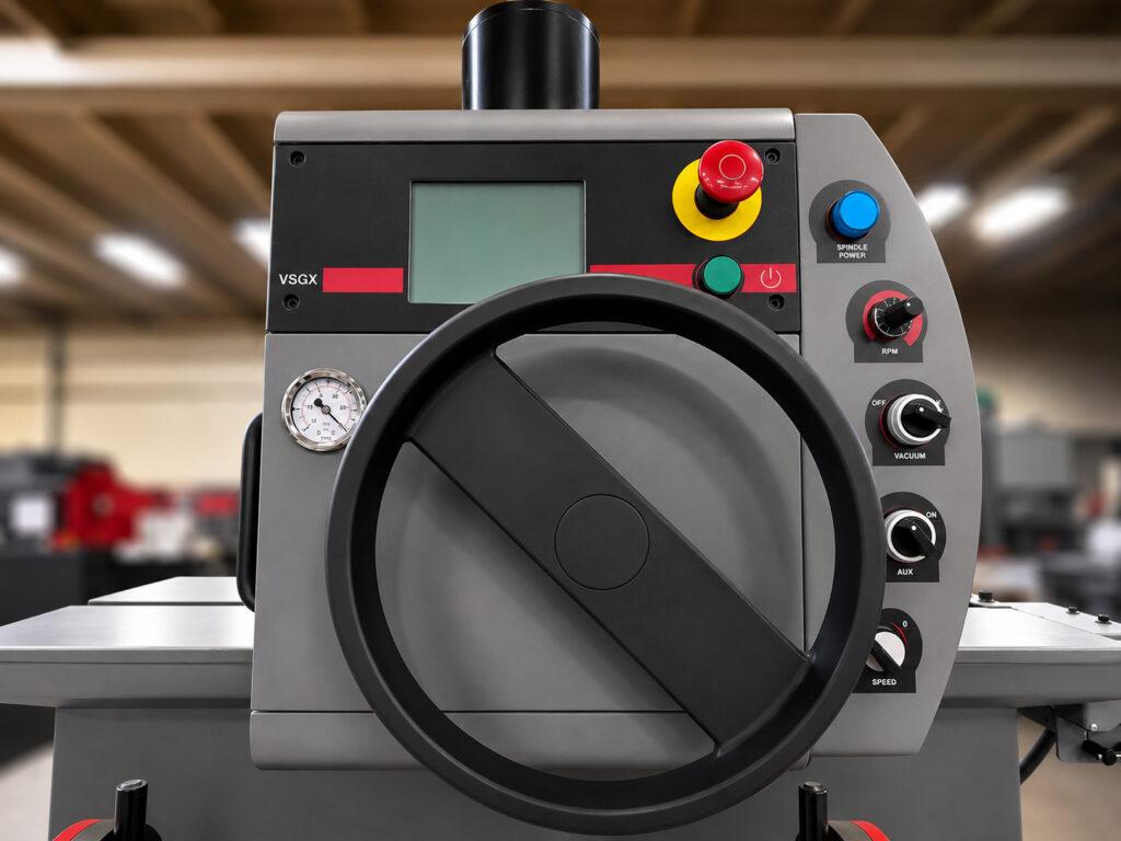 Close-up of the controls and height adjustment handwheel on a Winona Van Norman Seat and Guide Machine for precise machine setup and machining control.