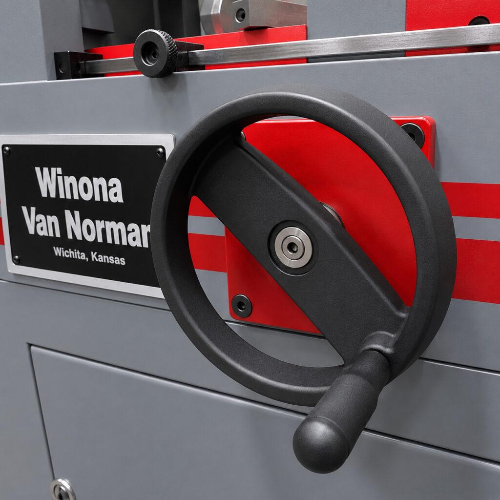 Close-up of the distance adjustment wheel on a Winona Van Norman Rod Boring Machine used to position the machining assembly for different connecting rod sizes.