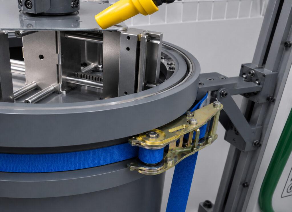 Close-up of the easy clamping system on the Winona Van Norman VHX Vertical Hone used to securely hold engine components during honing operations.