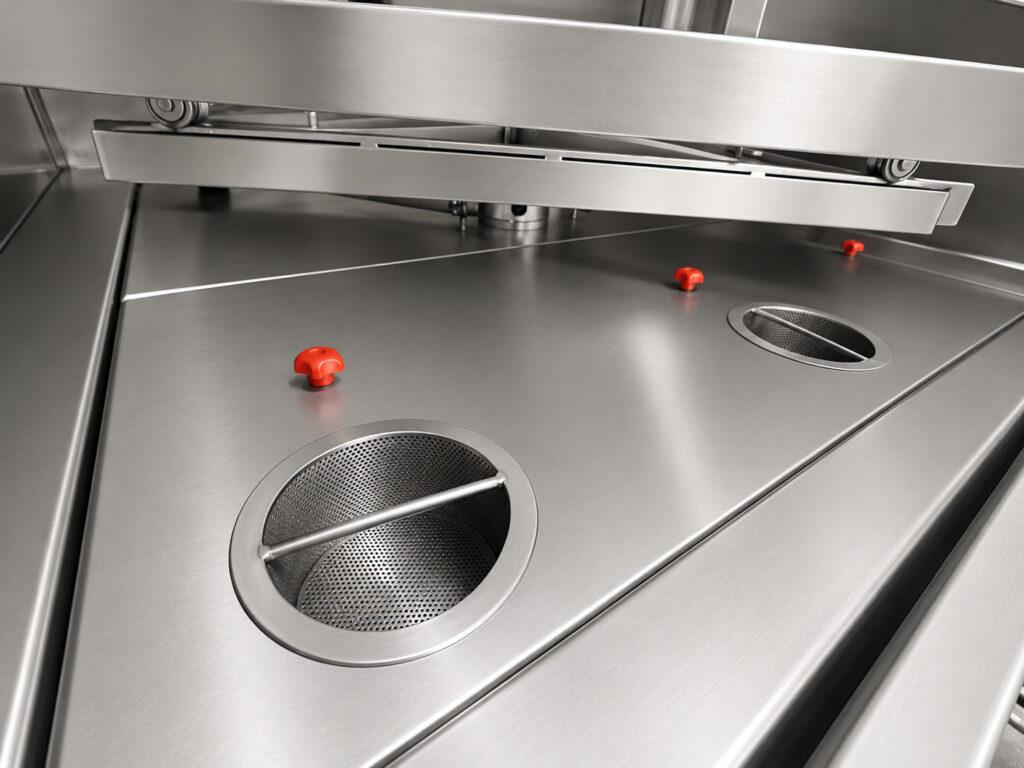 Close-up of the filtration system on a Winona Van Norman Stainless Steel Washer designed to capture debris and maintain cleaning solution quality.