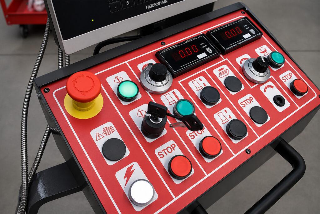 Close-up of the control buttons on the Winona Van Norman Vertical Boring Machine used to operate and adjust precision boring functions.