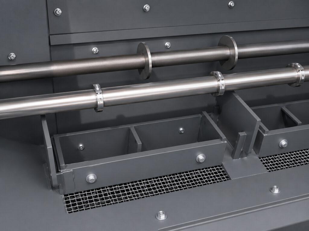 Interior view of a Winona Van Norman Fixed Basket Blaster showing the blasting chamber, basket, and heavy-duty construction designed for efficient abrasive cleaning.