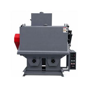 Angle view of the heavy-duty basket inside a Winona Van Norman Fixed Basket Blaster designed to securely hold parts during the shot blasting process.