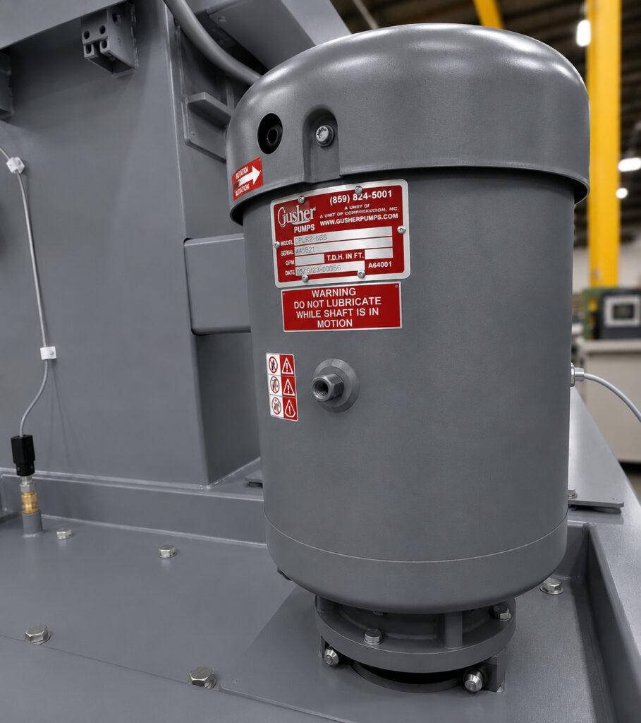 Close-up of the pump on a Winona Van Norman Table Washer providing high-pressure circulation of the cleaning solution.