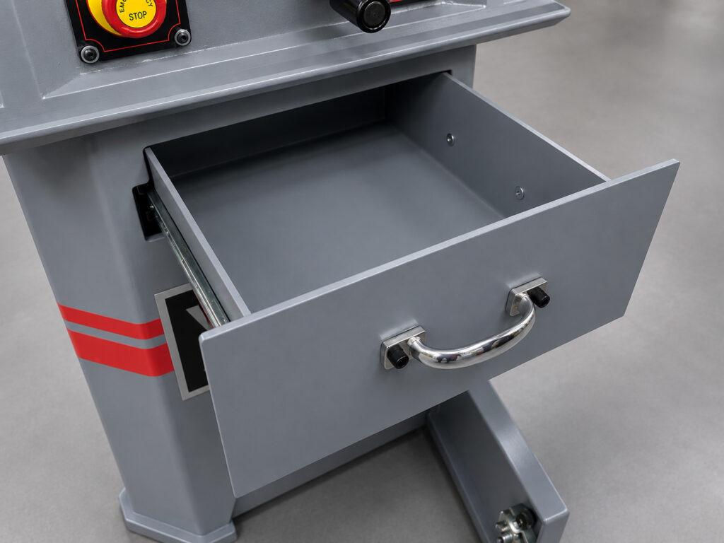 Close-up of the integrated storage compartment on a Winona Van Norman CBMX Small Engine Boring Machine used to organize tooling and machine accessories.