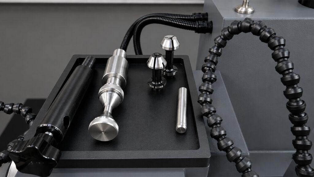 Close-up of the tooling for the Winona Van Norman Valve Refacer, including precision components used to securely hold and accurately grind engine valves.