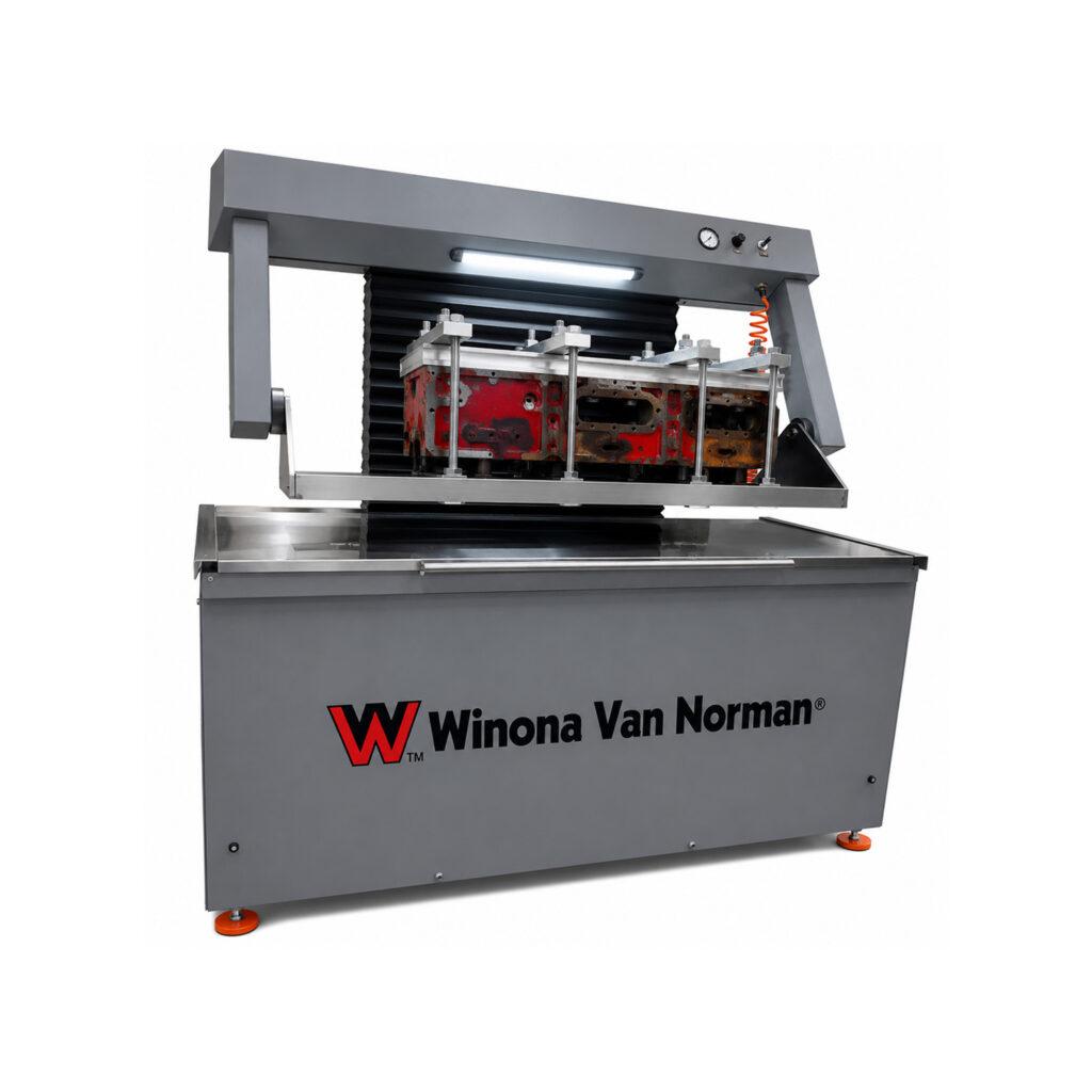 Angle view of the Winona Van Norman CHT1240 Pressure Tester showcasing the heavy-duty testing tank, control panel, and precision pressure testing system for engine components.