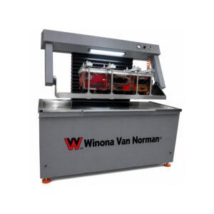 Angle view of the Winona Van Norman CHT1240 Pressure Tester showcasing the heavy-duty testing tank, control panel, and precision pressure testing system for engine components.