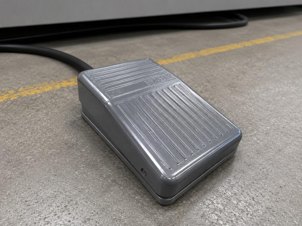 Close-up of the foot pedal on a Winona Van Norman Crankshaft Polisher used to provide hands-free control during polishing operations.