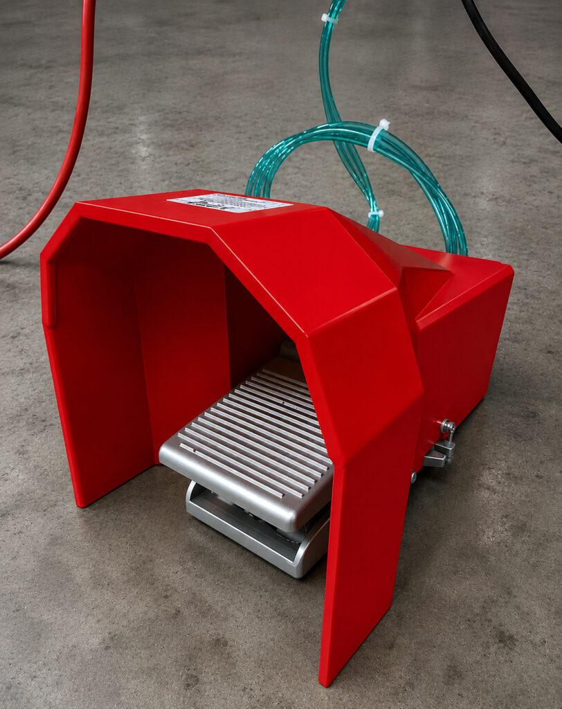 Close-up of the foot pedal on a Winona Van Norman Disassembly Bench providing hands-free control of the hydraulic lifting and positioning system.
