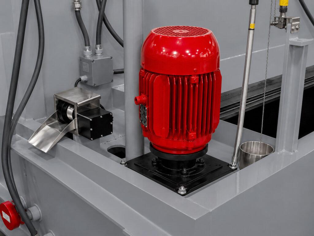 Close-up of the impeller motor on a Winona Van Norman Flow Through Washer providing power for the high-pressure wash system.