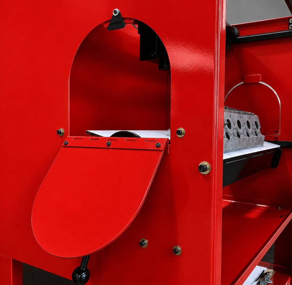 Close-up of the side access opening on a Winona Van Norman Disassembly Bench designed to accommodate larger engine heads and engine blocks during service operations.