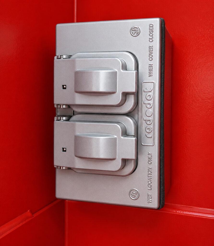 Close-up of the integrated electrical outlet inside a Winona Van Norman Disassembly Bench providing convenient power access for service tools and equipment.