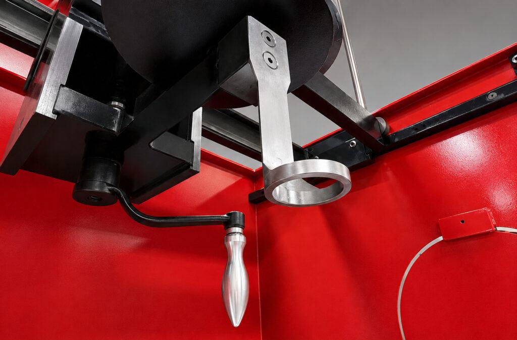 Close-up of the pressing mechanism on a Winona Van Norman Disassembly Bench used to safely apply controlled force during engine component disassembly.