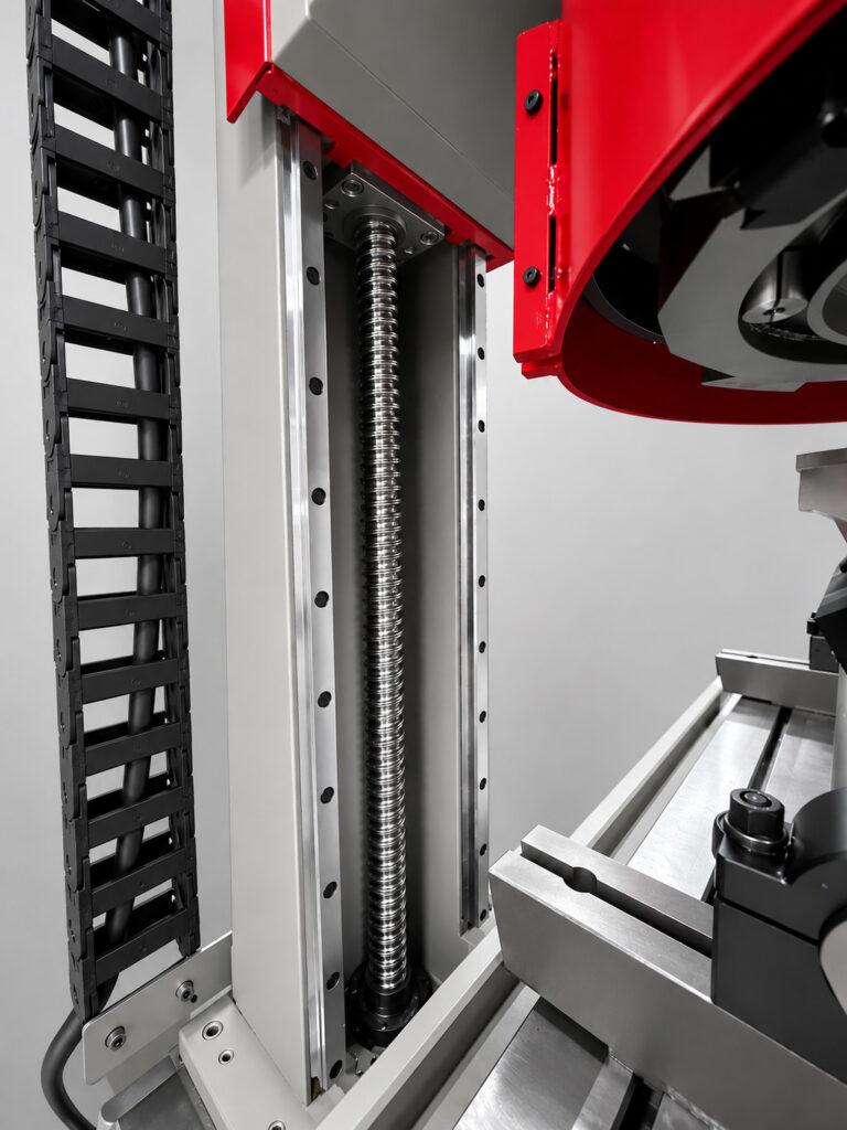 Close-up of the belt and guide rod assembly on the Winona Van Norman SM-E Surface Milling Machine that provides smooth, precise movement of the milling head.