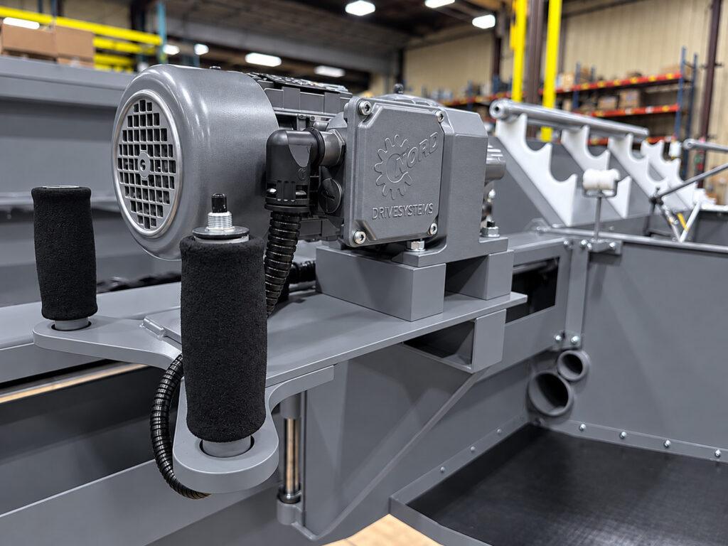 Drive head and primary motor control button on the Winona Van Norman LH3X Line Hone designed to provide direct operator control during precision main bearing bore honing.