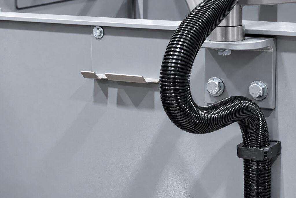 Gauge bracket on the Winona Van Norman LH3X Line Hone designed to securely position a measuring gauge for accurate main bearing bore measurements during line honing.